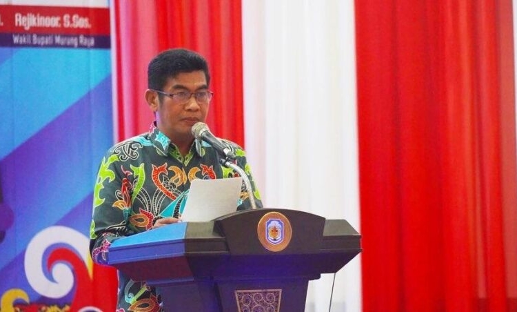 Kepala Dinas Komunikasi, Informatika, Persandian dan Statistik Prov. Kalteng Agus Siswadi saat membacakan sambutan tertulis Gubernur Kalteng Sugianto Sabran. (Photo/ist)