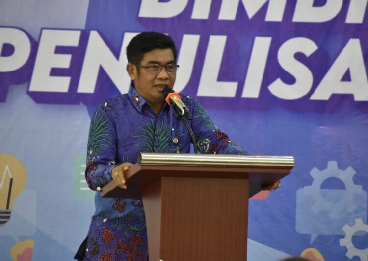 Kepala Diskominfosantik Prov. Kalteng Agus Siswadi saat membaca sambutan. (Photo/ist)