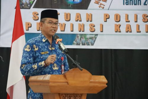 Plh Sahli Gubernur Bidang Pemkumpol Akhmad Husain saat membacakan sambutan.(Photo/asep)