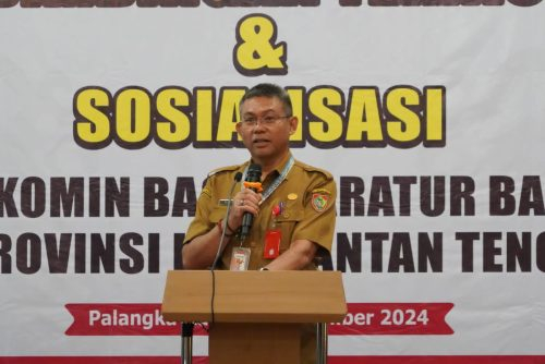 Plh Sahli Gubernur Bidang Pemkumpol Akhmad Husain saat membacakan sambutan.(Photo/rinto)